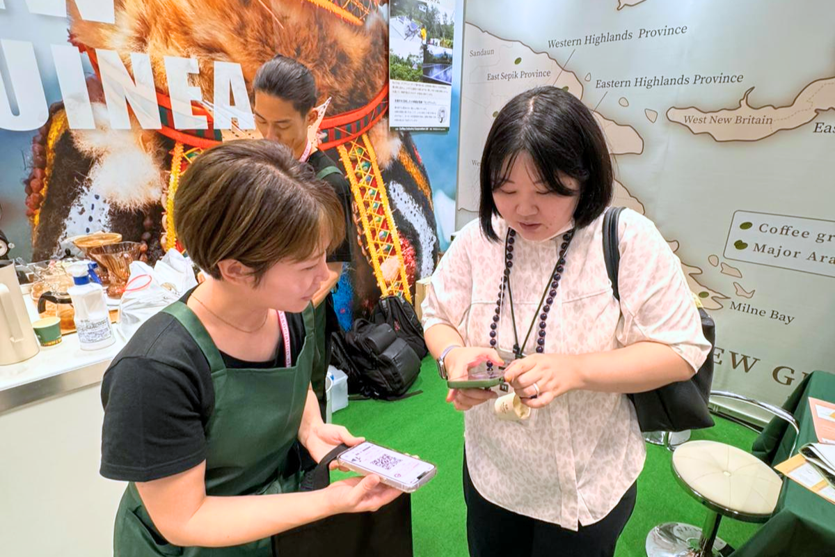 Discussion about Papua New Guinea specialty coffee production and export initiatives at SCAJ 2025