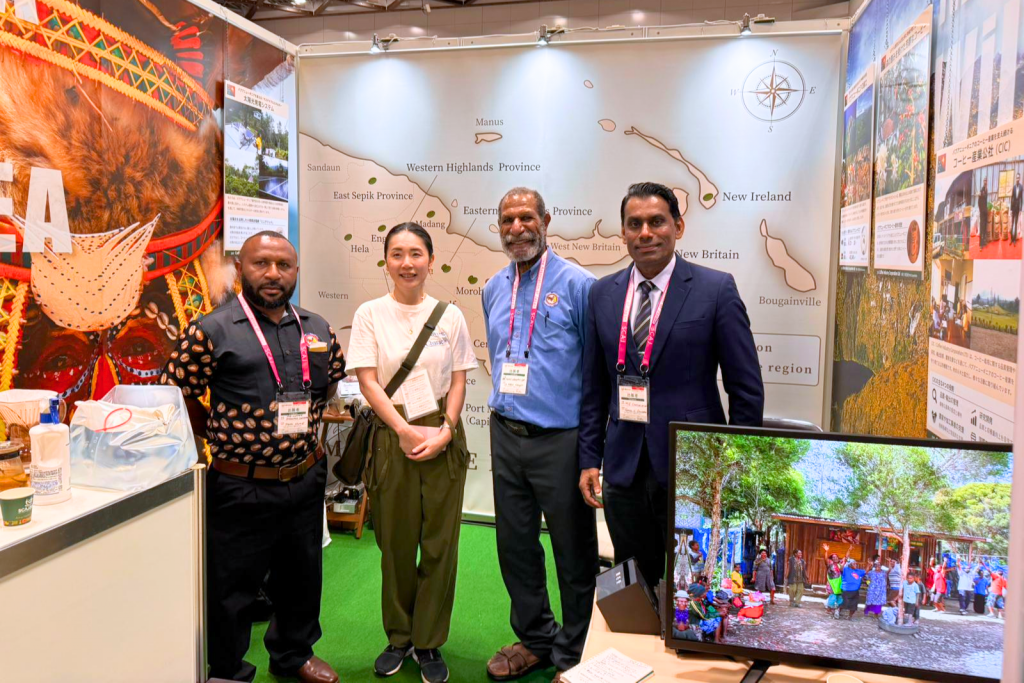 Representatives from Papua New Guinea’s coffee industry meeting visitors at SCAJ 2025